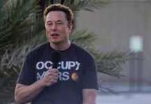 Musk gets booed by crowd at show